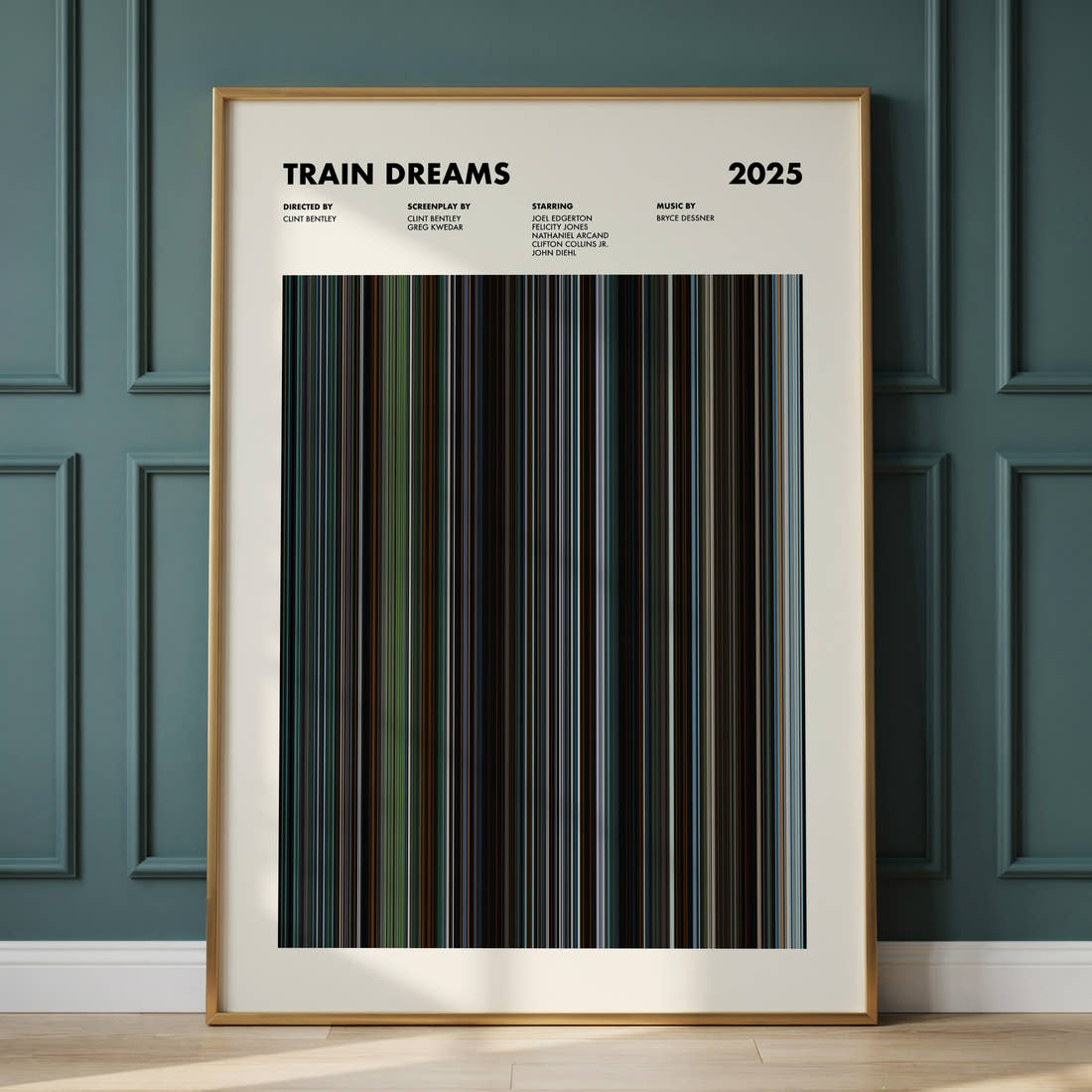 Train Dreams Movie Barcode Poster framed and leaning against a panelled wall