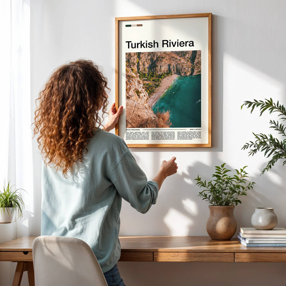 Turkish Riviera Aerial Coastal Cliffs Travel Print framed on a pale wall beside houseplants