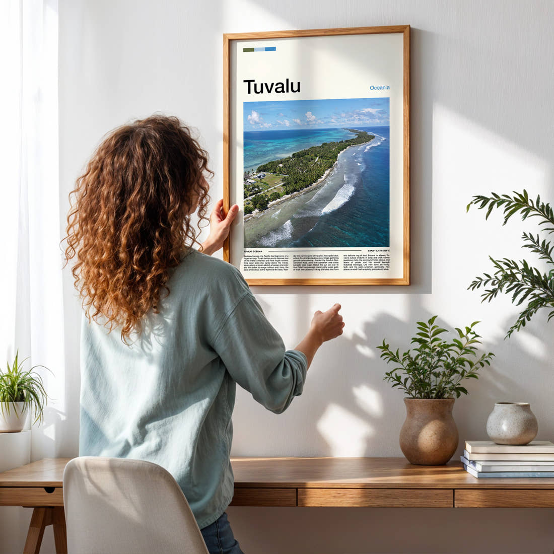 Tuvalu Aerial Atoll View Travel Print framed on a pale wall beside houseplants