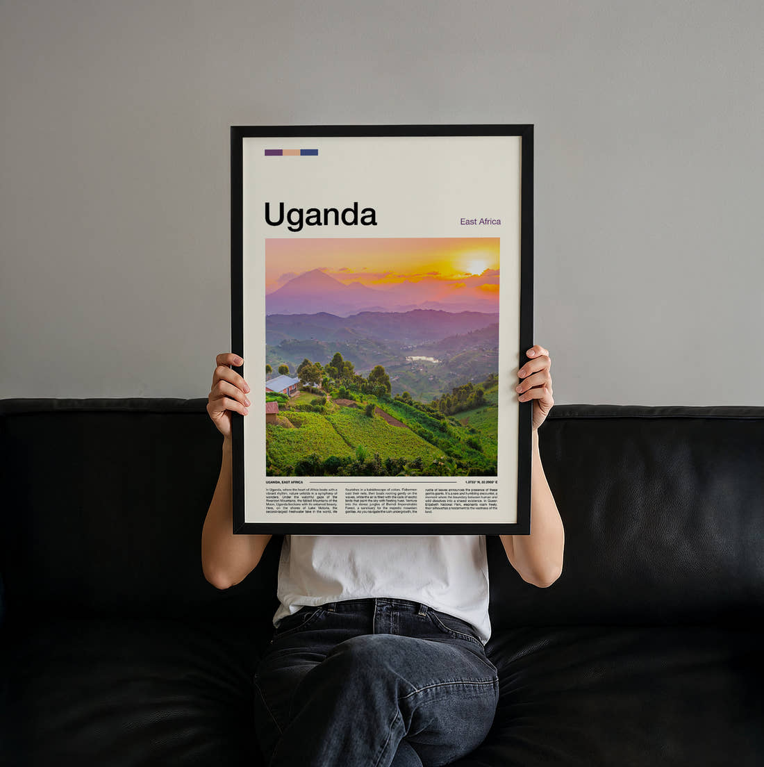 Uganda Green Hills At Sunset Travel Print held up by hand to show the size of the print