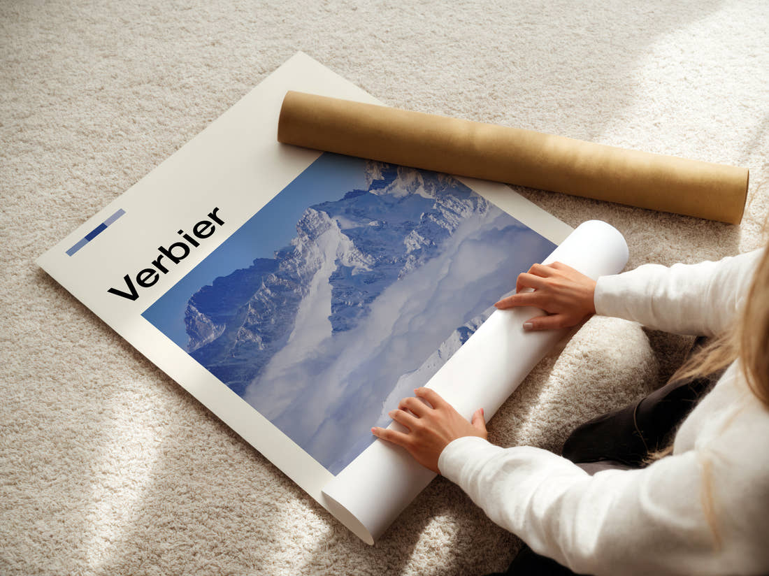 Verbier Peaks Above The Clouds Travel Print being unrolled from its postal tube