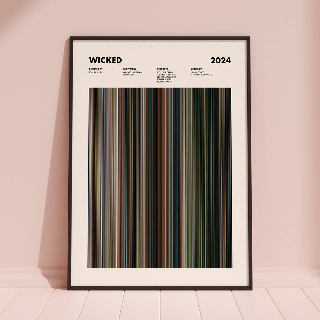 Wicked Movie Barcode Poster framed and leaning against a coloured wall