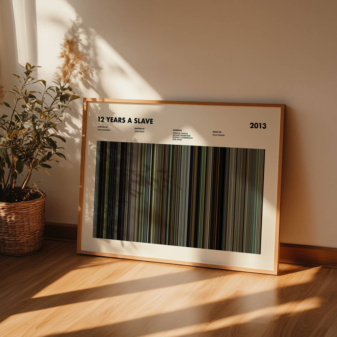 12 Years a Slave Movie Barcode Poster framed and leaning against a wall on a wooden floor
