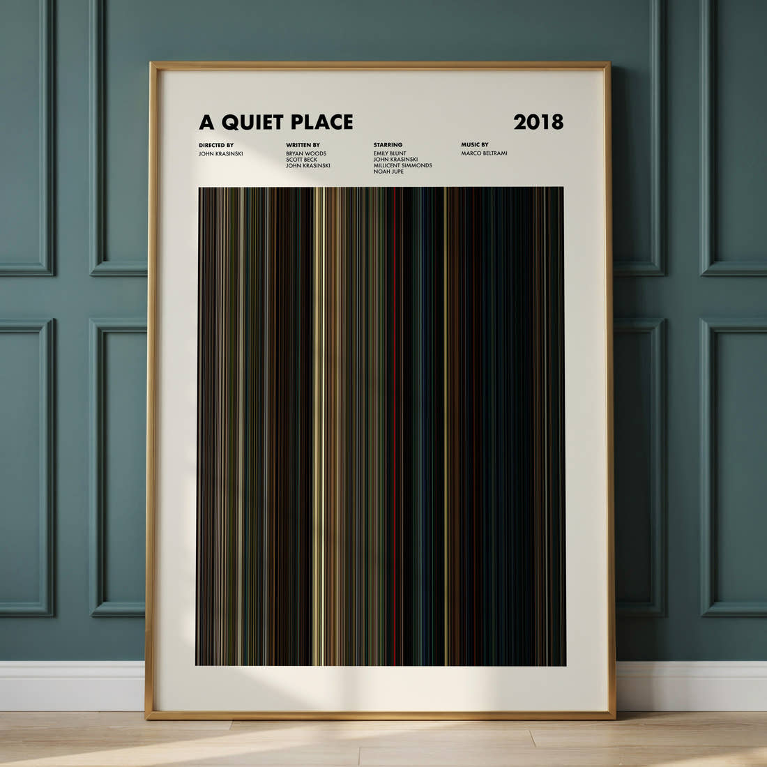 A Quiet Place Movie Barcode Poster framed and leaning against a panelled wall