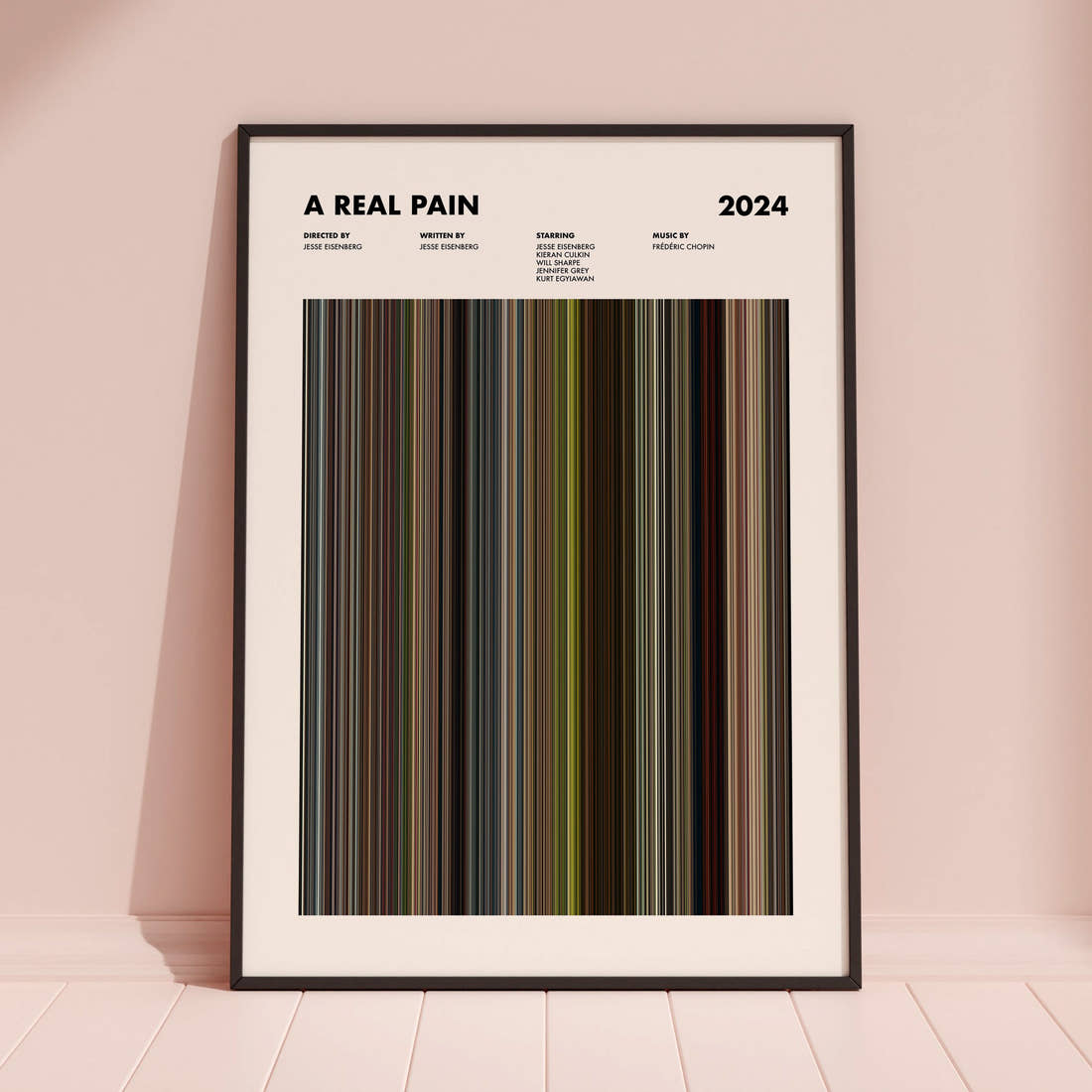 A Real Pain Movie Barcode Poster framed and leaning against a coloured wall