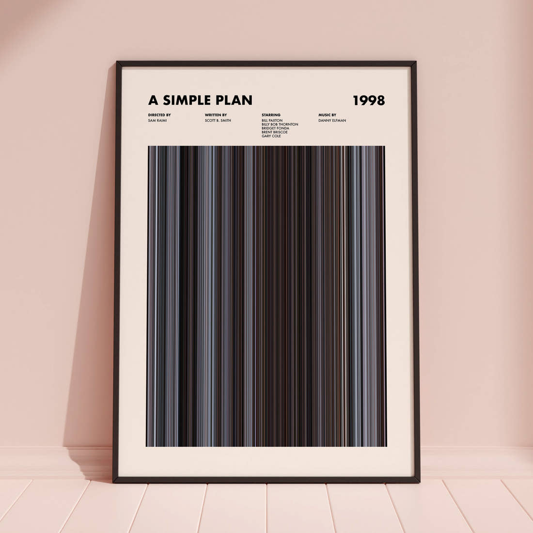 A Simple Plan Movie Barcode Poster framed and leaning against a coloured wall