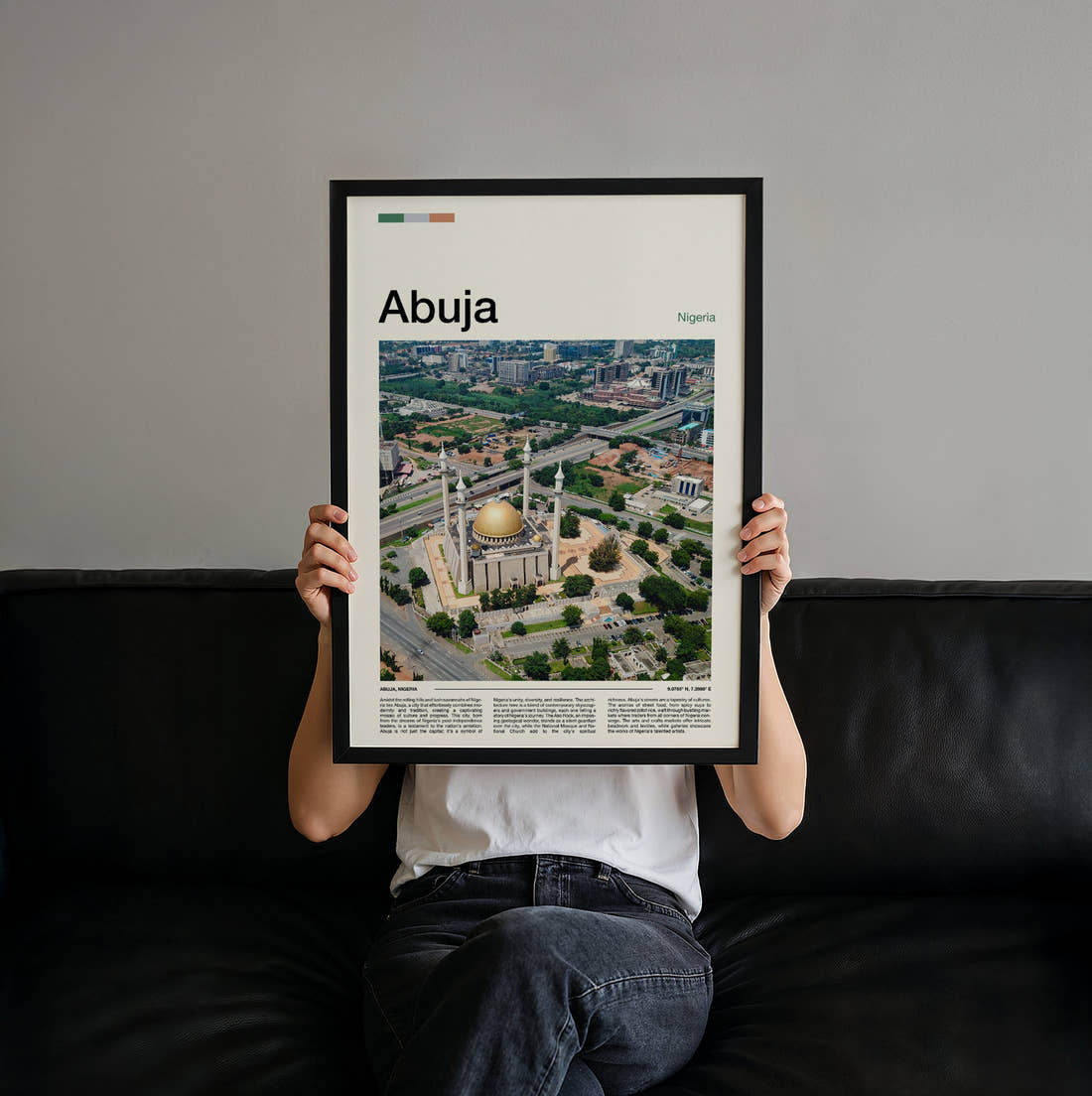 Abuja National Mosque Aerial Travel Print held up by hand to show the size of the print