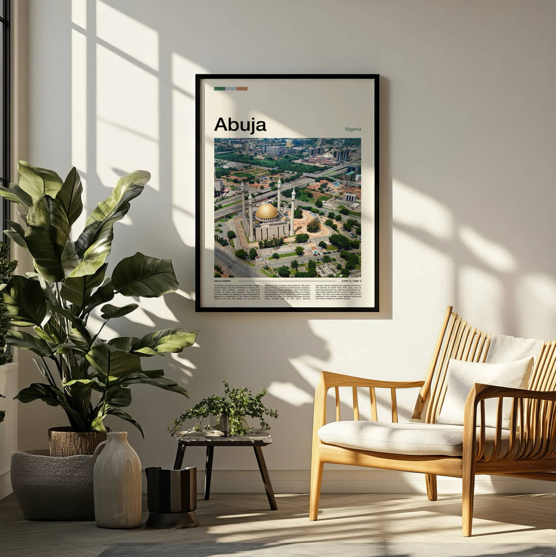 Abuja National Mosque Aerial Travel Print framed on a pale wall beside houseplants
