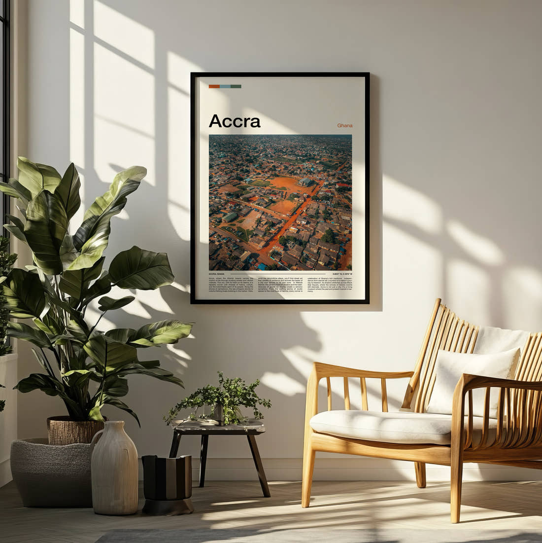 Accra Aerial City View Travel Print framed on a pale wall beside houseplants