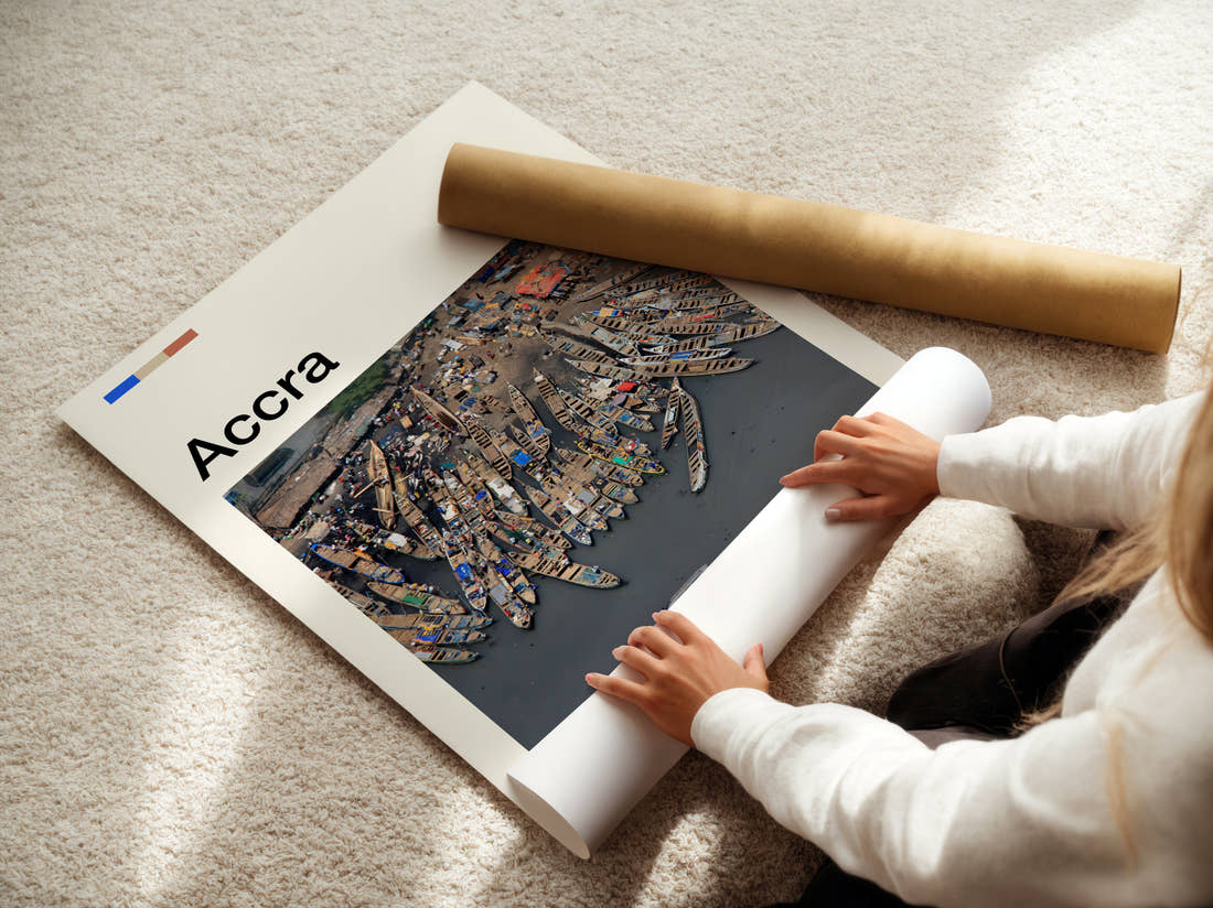 Accra Fishing Boats Travel Print being unrolled from its postal tube
