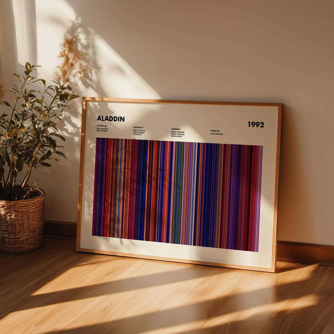 Aladdin Movie Barcode Poster framed and leaning against a wall on a wooden floor