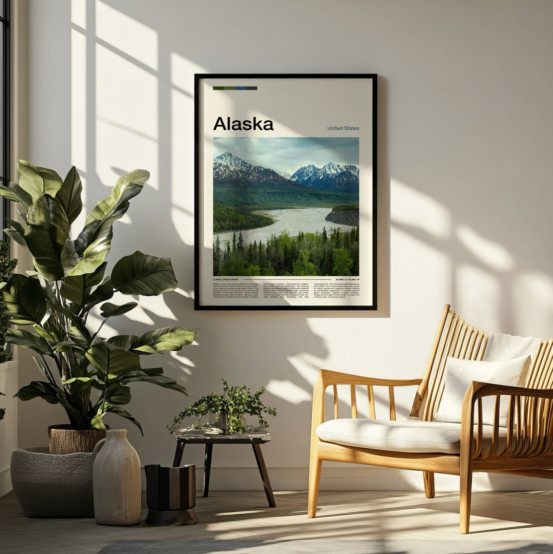 Alaska River Valley And Mountains Travel Print framed on a pale wall beside houseplants