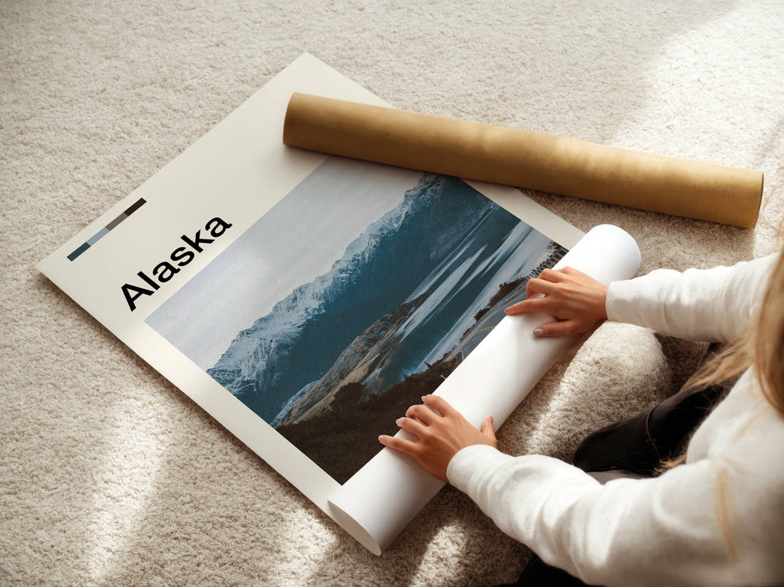 Alaska Coastal Road And Mountains Travel Print being unrolled from its postal tube