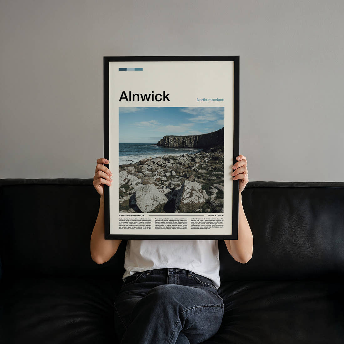 Alnwick Rocky Coastal Cliffs Travel Print held up by hand to show the size of the print