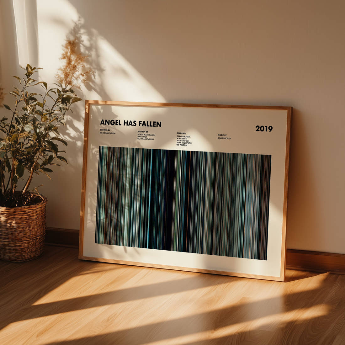 Angel Has Fallen Movie Barcode Poster framed and leaning against a wall on a wooden floor
