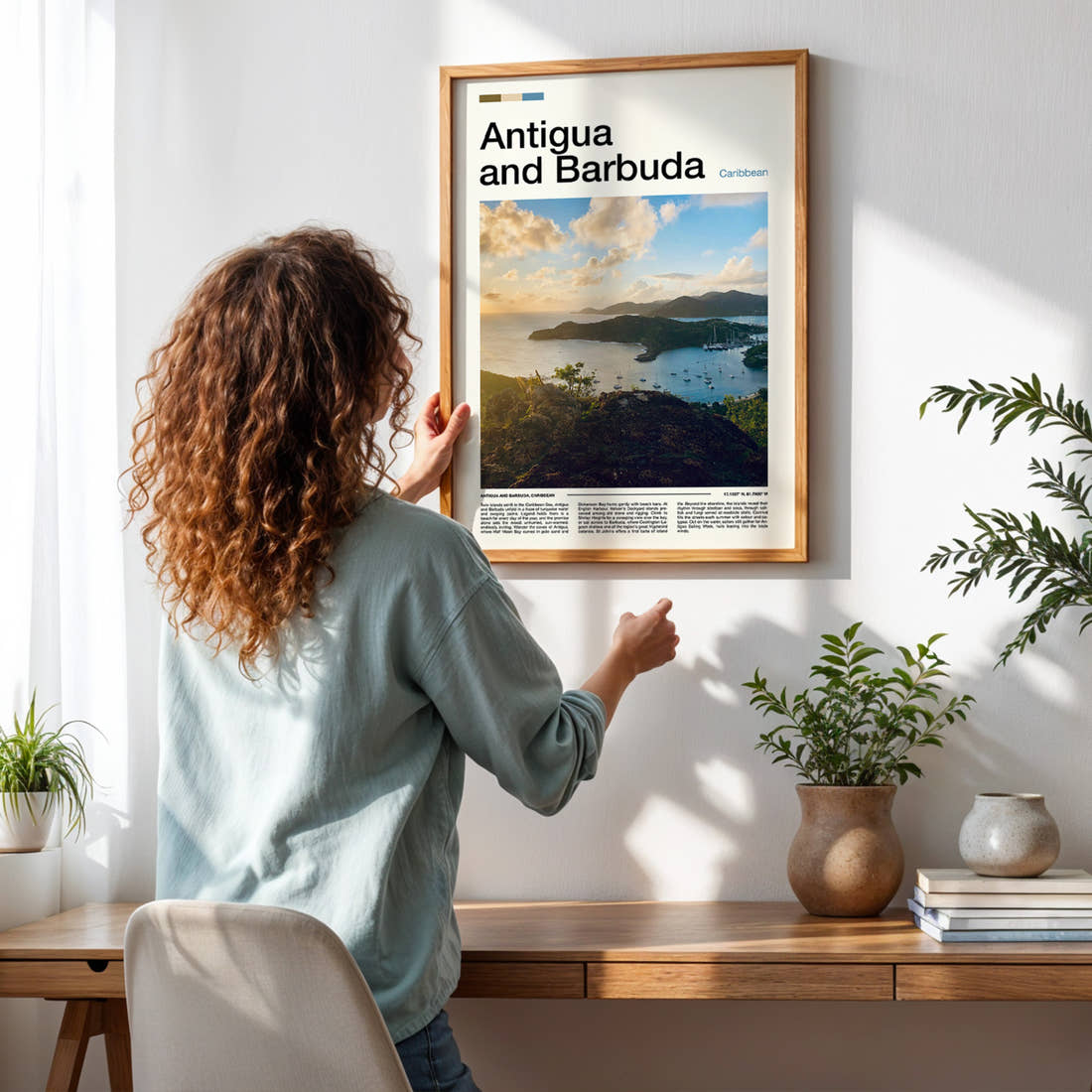 Antigua and Barbuda Harbour From Above Travel Print framed on a pale wall beside houseplants
