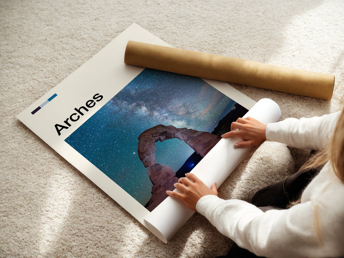 Arches Starlit Sandstone Arch Travel Print being unrolled from its postal tube