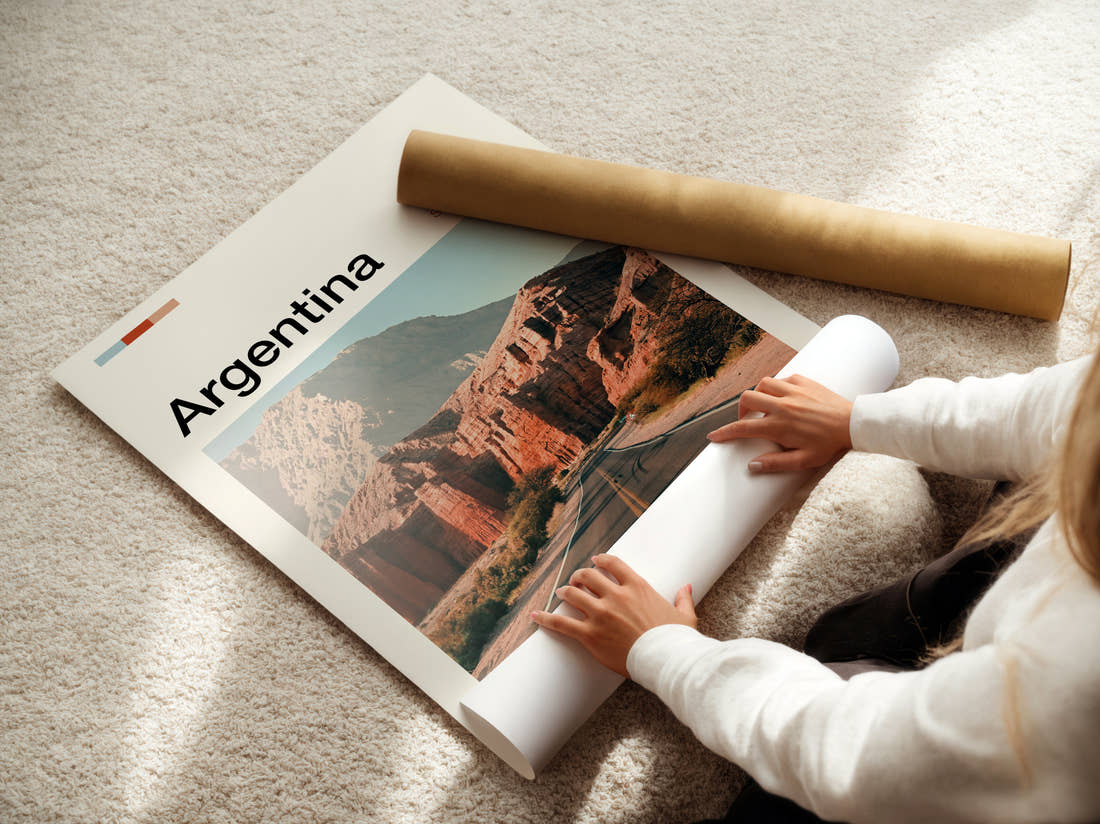 Argentina Road Through Red Rocks Travel Print being unrolled from its postal tube