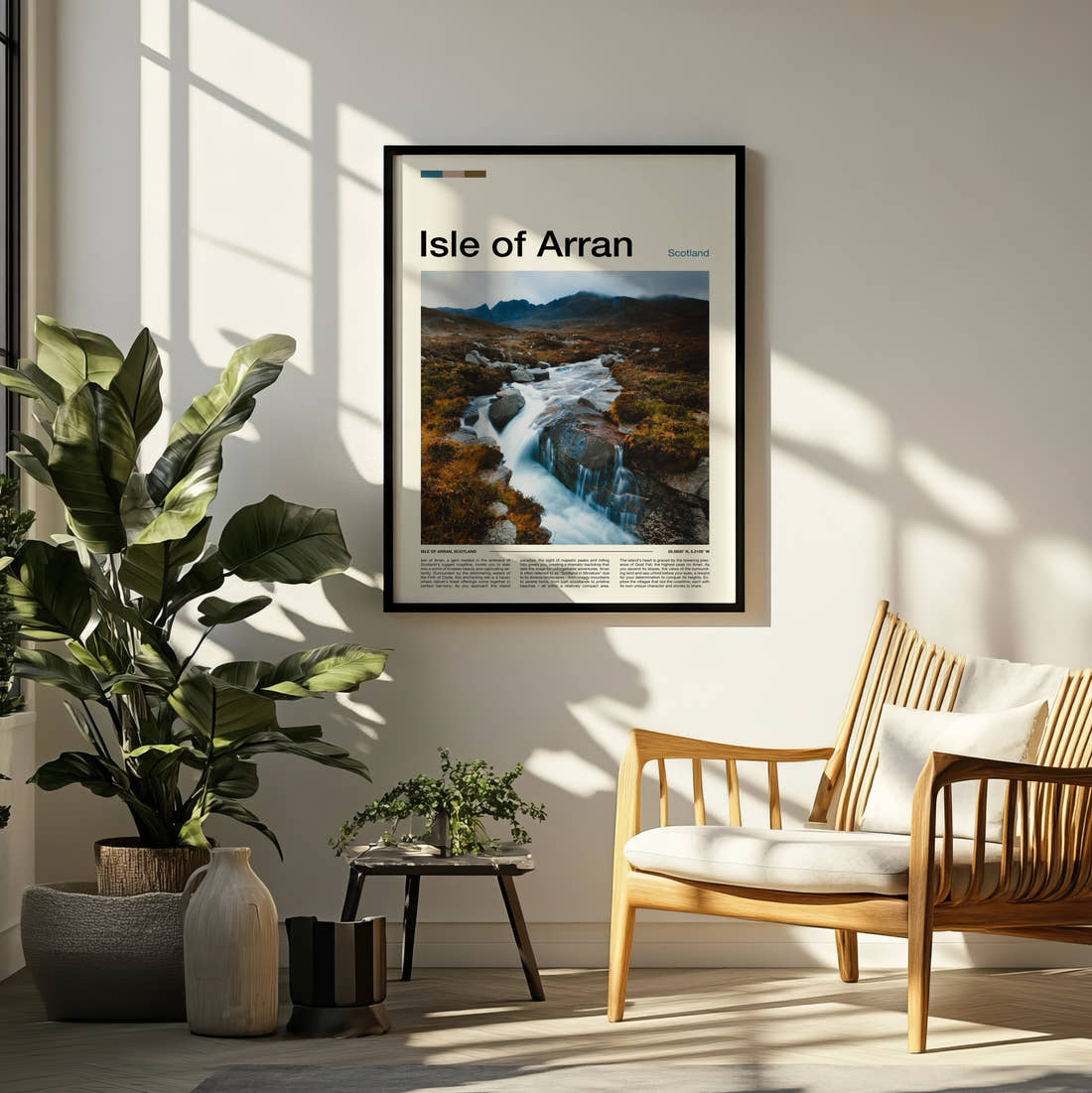 Arran Travel Print framed on a pale wall beside houseplants