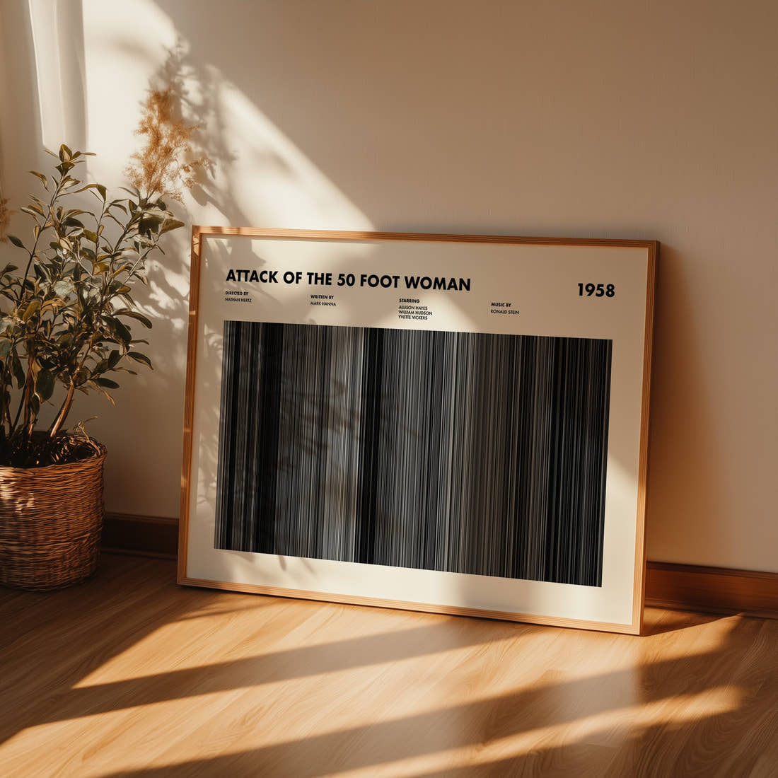 Attack of the 50 Foot Woman Movie Barcode Poster framed and leaning against a wall on a wooden floor