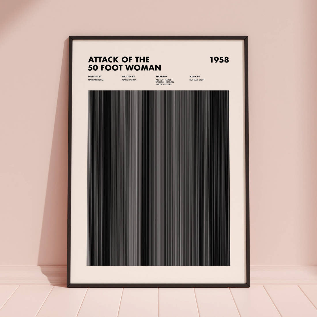 Attack of the 50 Foot Woman Movie Barcode Poster framed and leaning against a coloured wall