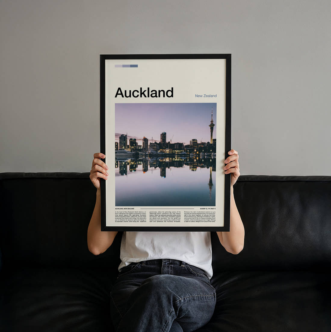 Auckland Sky Tower Reflection Travel Print held up by hand to show the size of the print