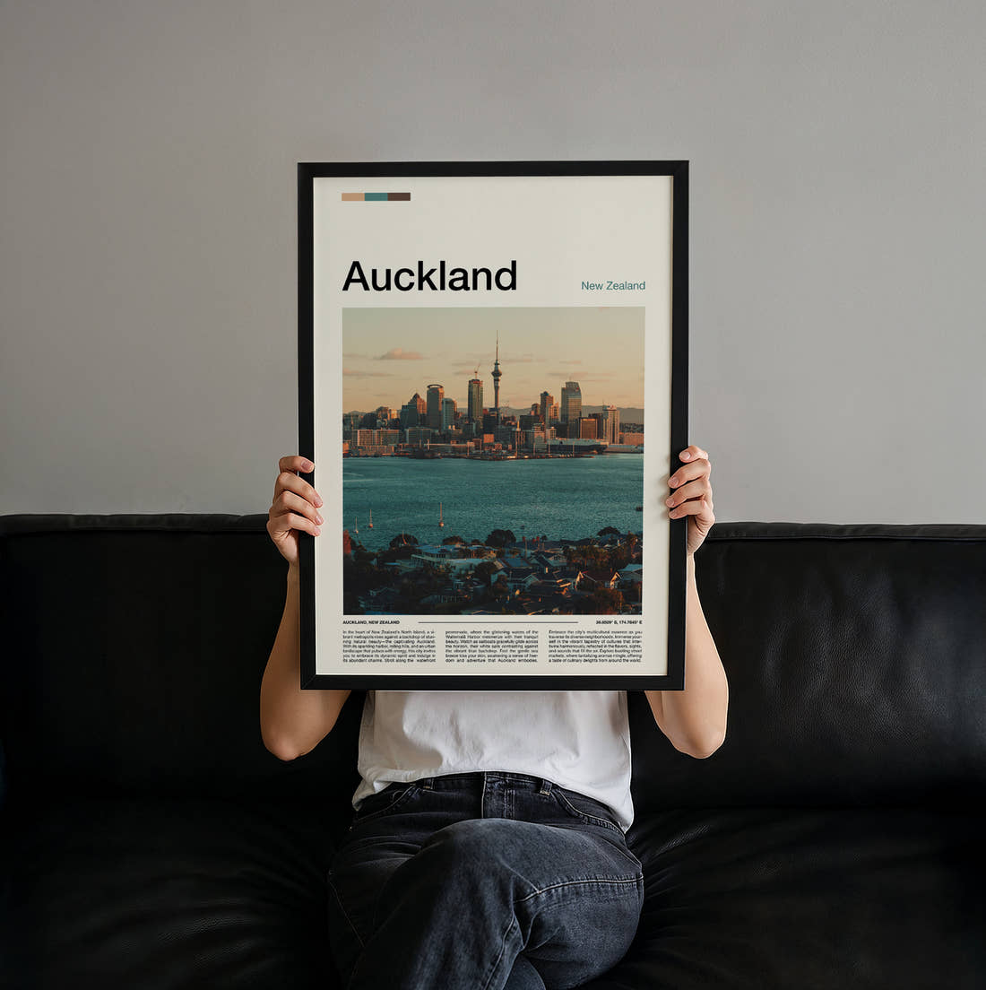Auckland Sky Tower And Waterfront Travel Print held up by hand to show the size of the print