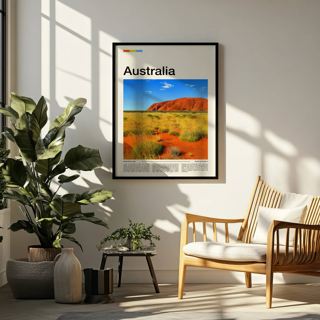 Australia Uluru Travel Print framed on a pale wall beside houseplants