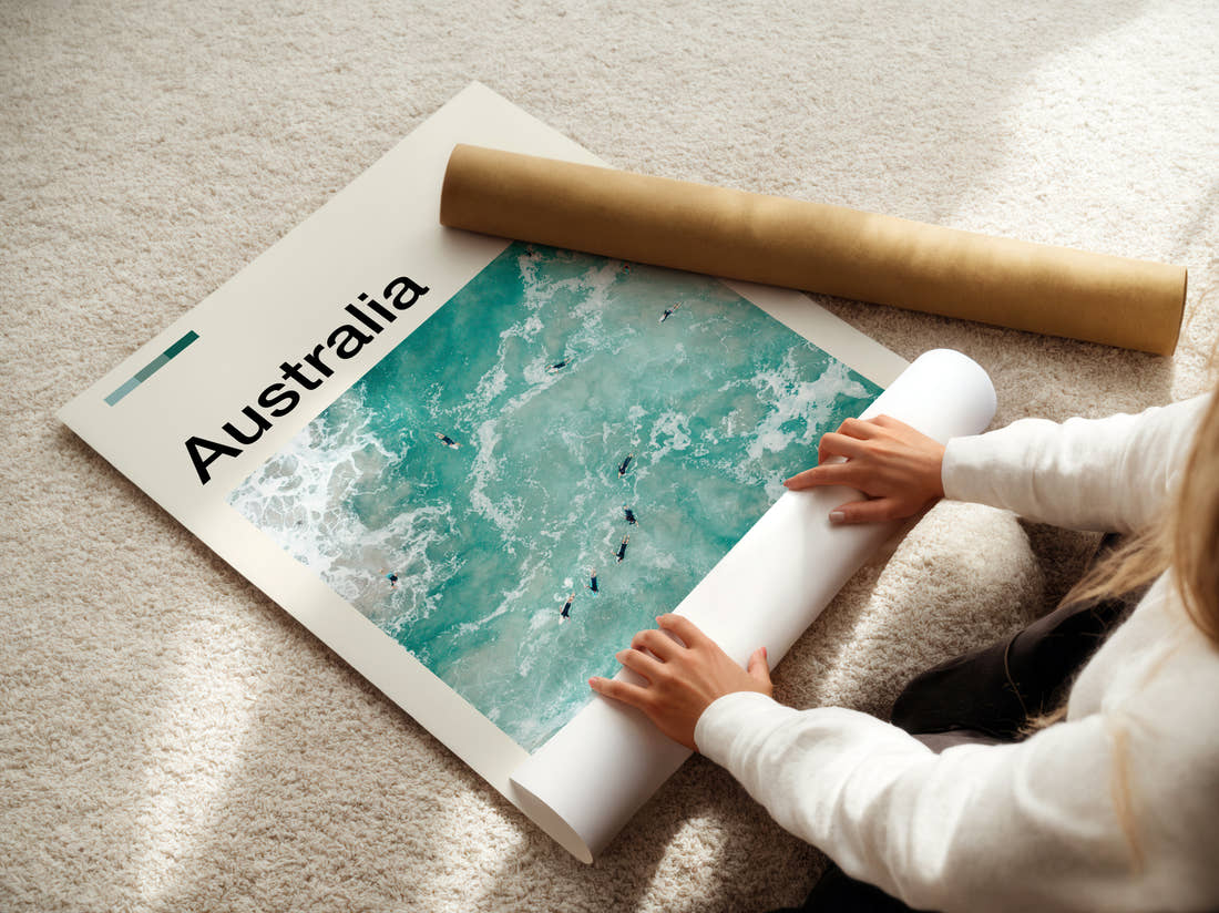 Australia Surfers In The Waves Travel Print being unrolled from its postal tube