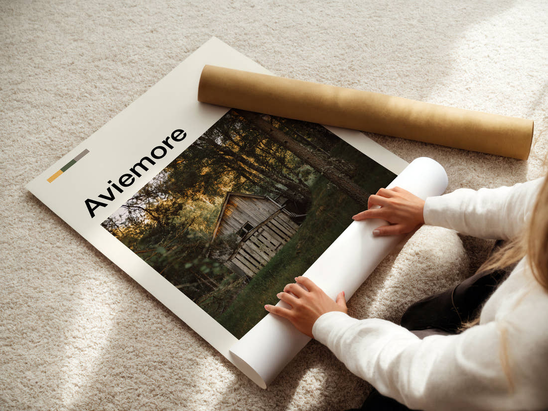 Aviemore Wooden Hut In Forest Travel Print being unrolled from its postal tube