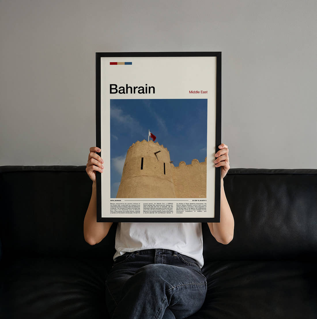 Bahrain Fort Wall And Flag Travel Print held up by hand to show the size of the print