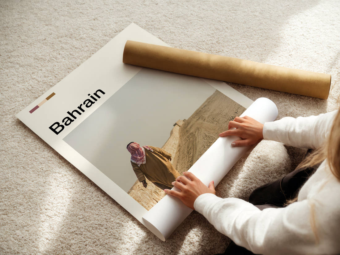 Bahrain Man In Traditional Dress Travel Print being unrolled from its postal tube
