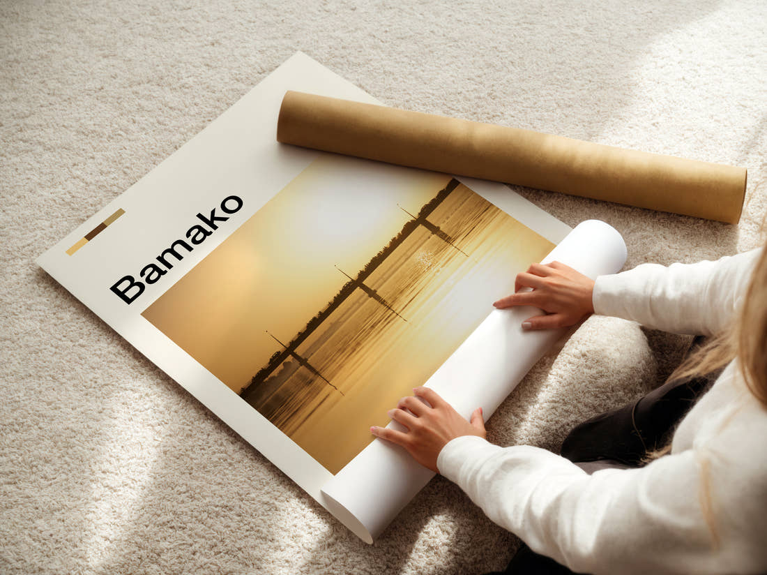 Bamako Bridge At Sunset Travel Print being unrolled from its postal tube