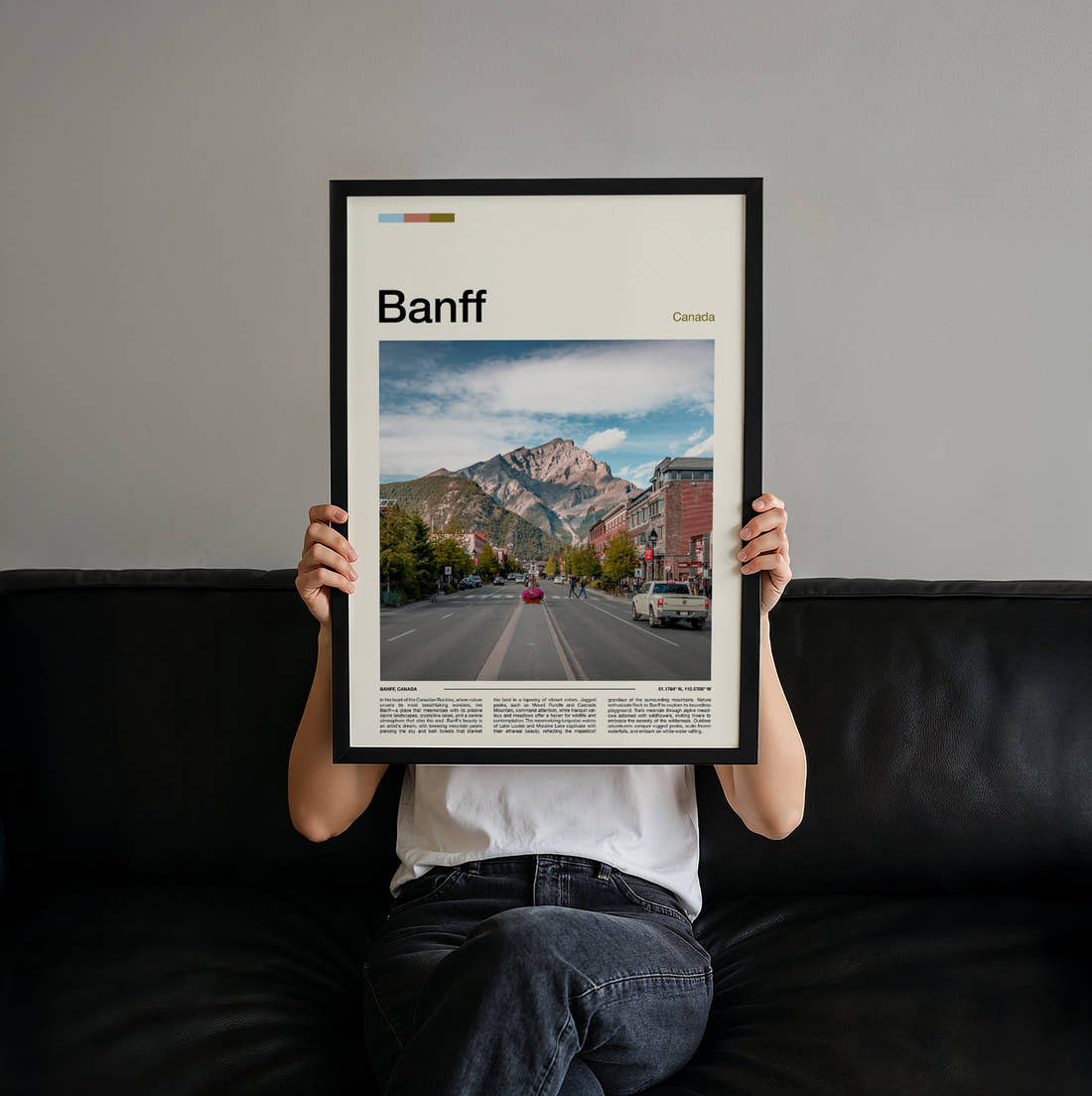 Banff Main Street And Mountain Travel Print held up by hand to show the size of the print