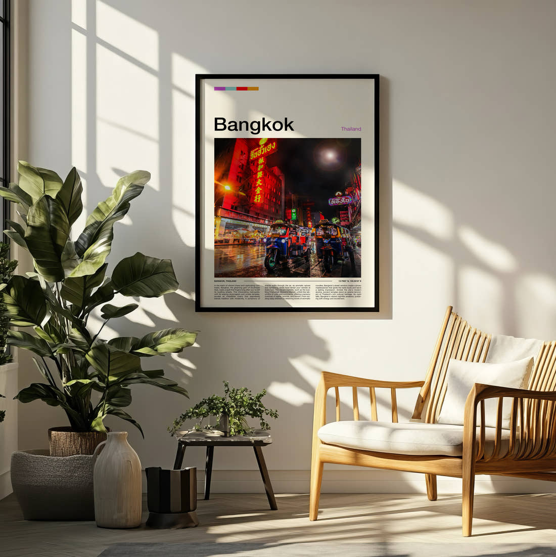 Bangkok Chinatown Neon Signs Travel Print framed on a pale wall beside houseplants