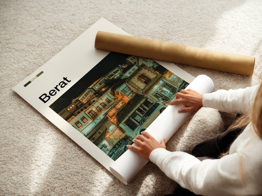 Berat Old Town By Night Travel Print being unrolled from its postal tube