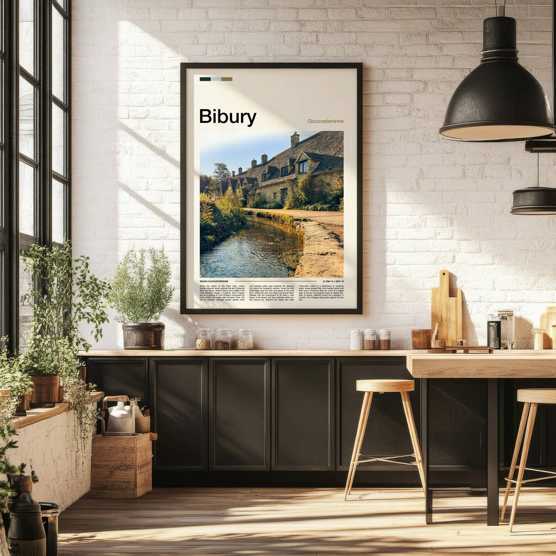 Bibury Riverside Cottage Row Travel Print framed on the wall of a bright kitchen and dining space