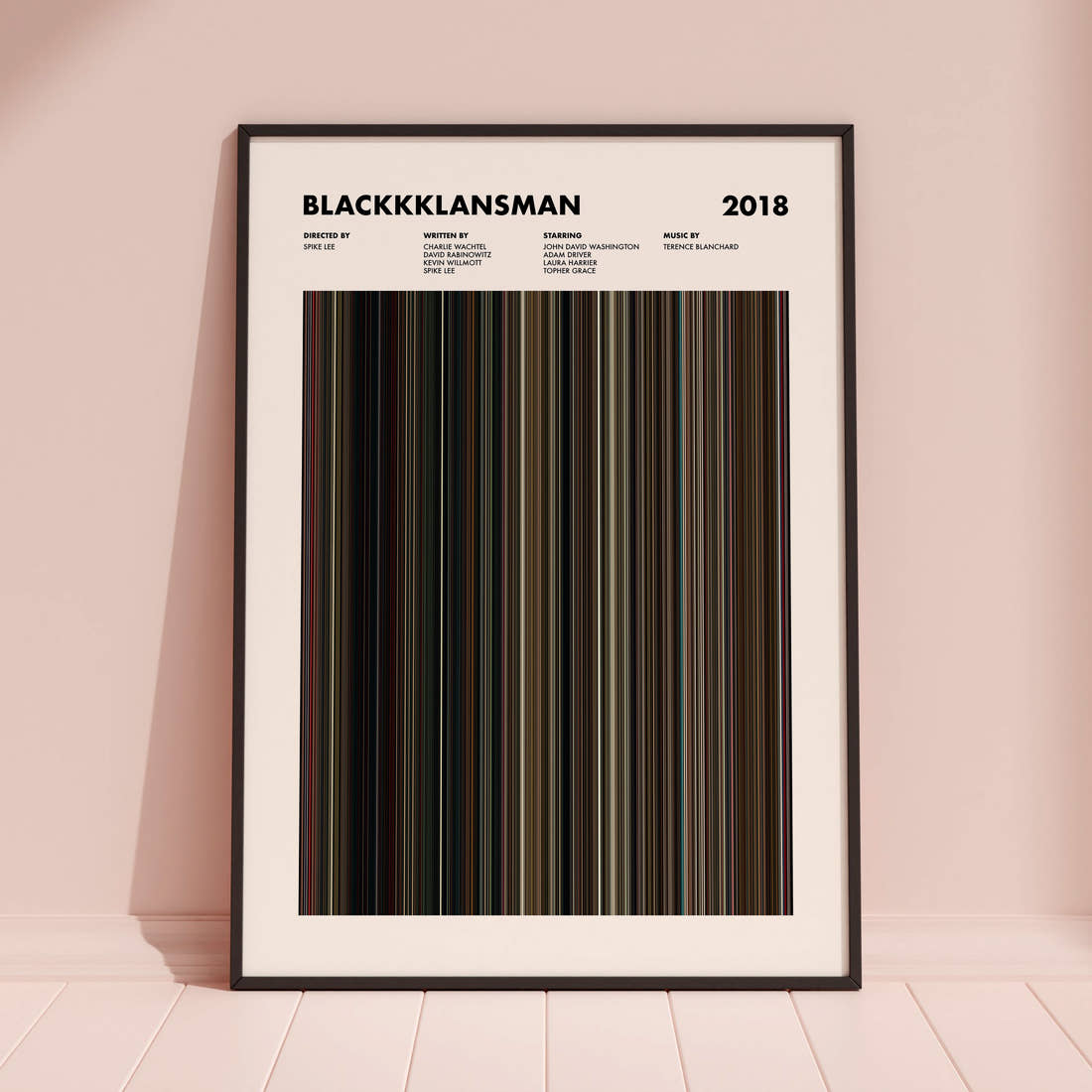 BlacKkKlansman Movie Barcode Poster framed and leaning against a coloured wall