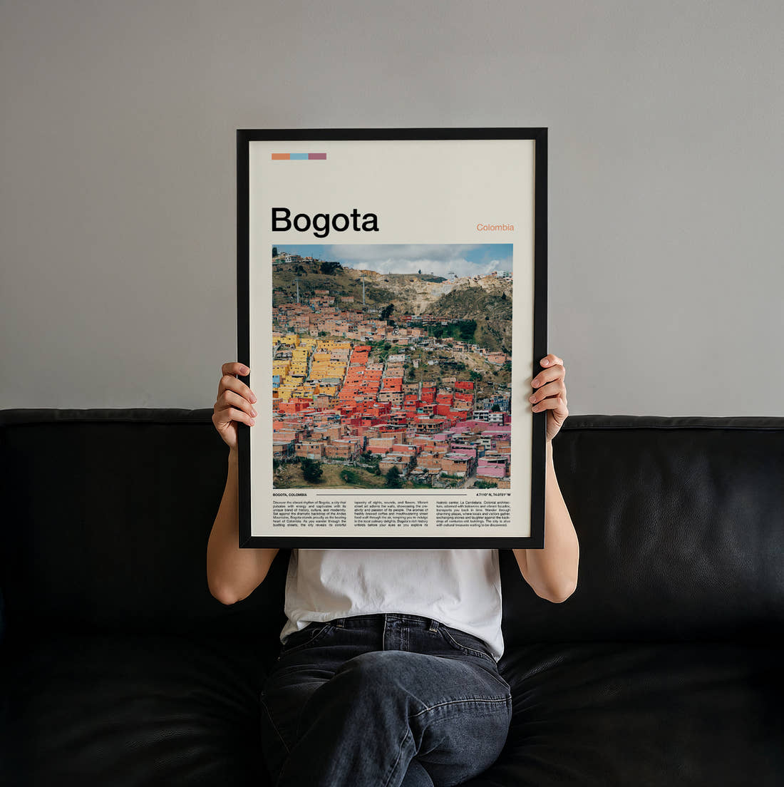 Bogota Colourful Hillside Houses Travel Print held up by hand to show the size of the print