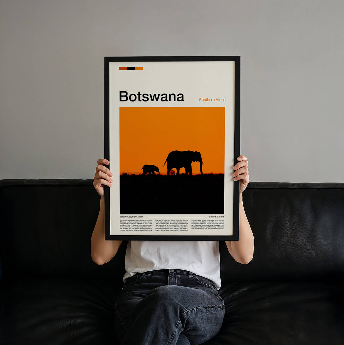 Botswana Elephants At Sunset Travel Print held up by hand to show the size of the print