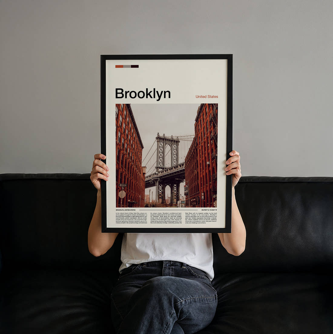 Brooklyn Manhattan Bridge Between Red Brick Walls Travel Print held up by hand to show the size of the print