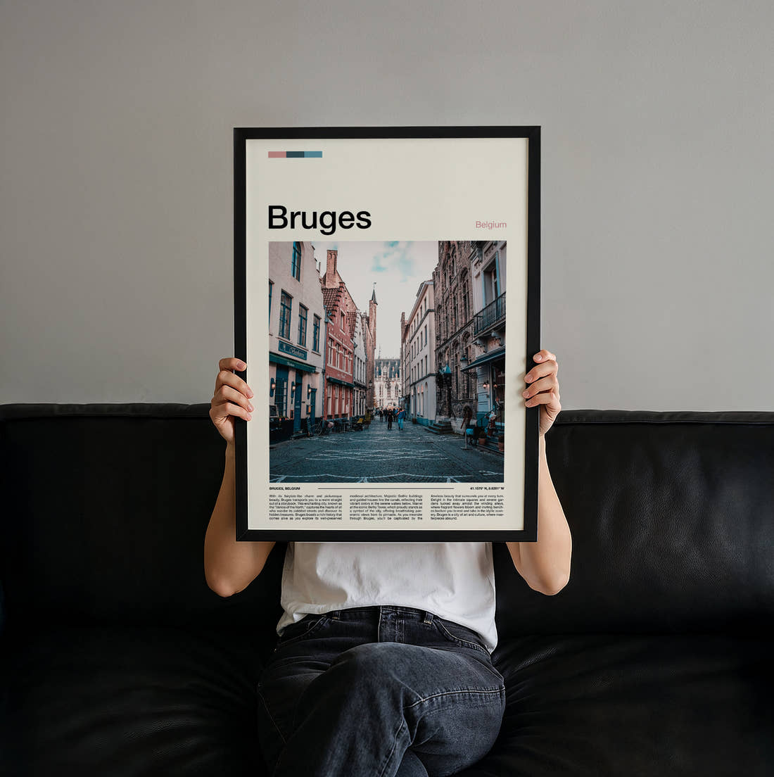 Bruges Cobbled Street Travel Print held up by hand to show the size of the print