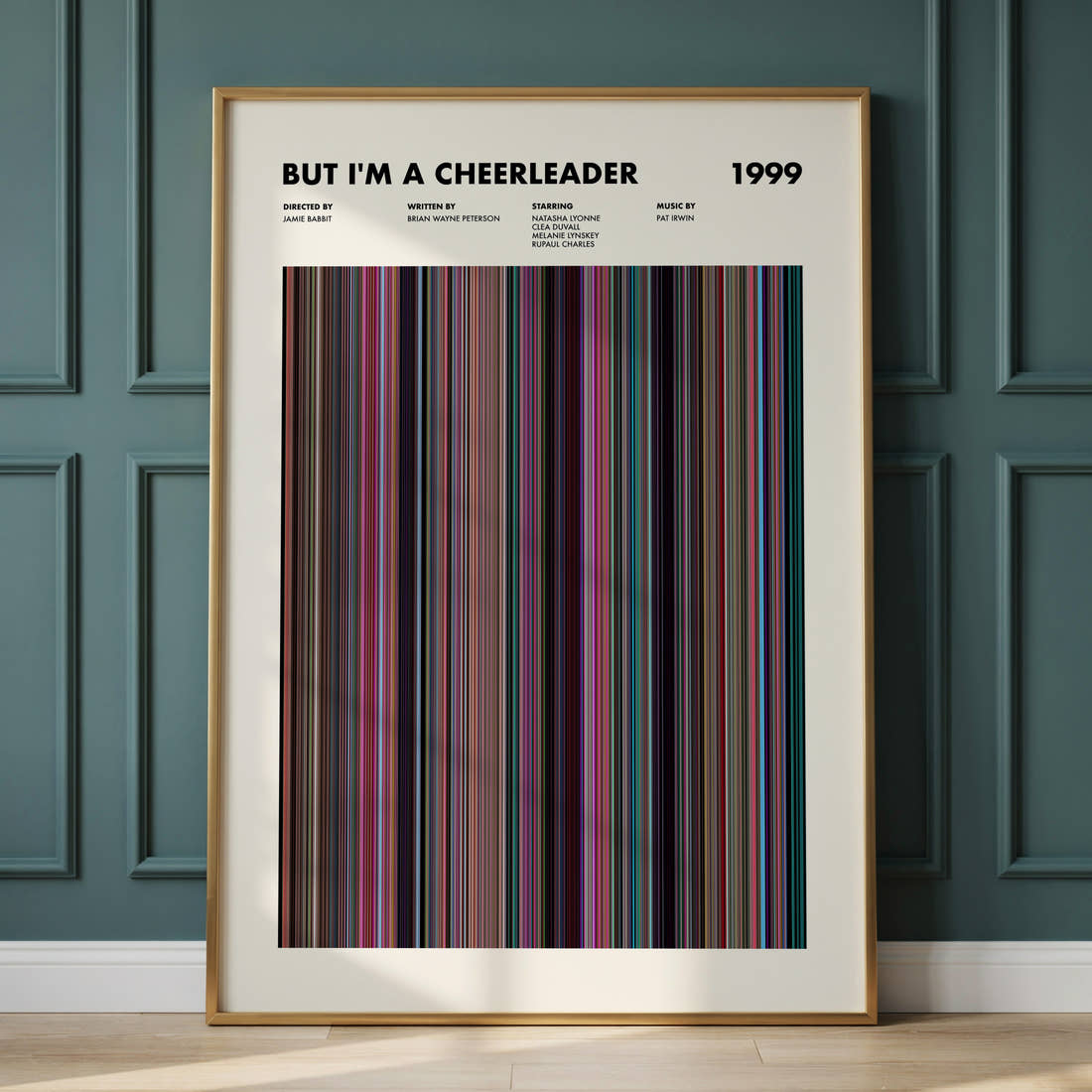 But I'm a Cheerleader Movie Barcode Poster framed and leaning against a panelled wall