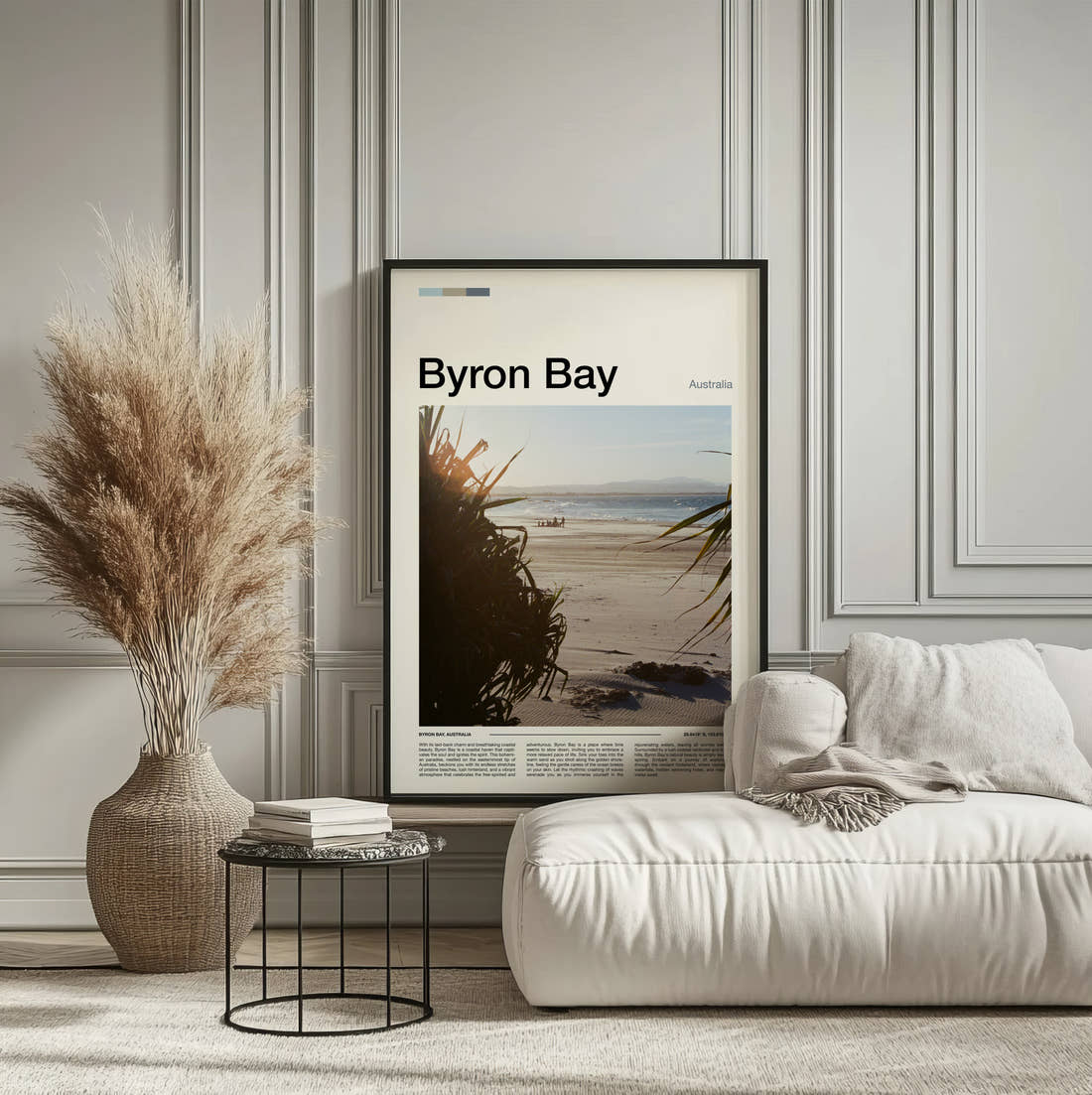 Byron Bay Beach Through Palm Leaves Travel Print framed on the wall of a calm, neutral bedroom