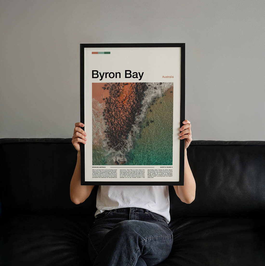 Byron Bay Rocky Reef From Above Travel Print held up by hand to show the size of the print