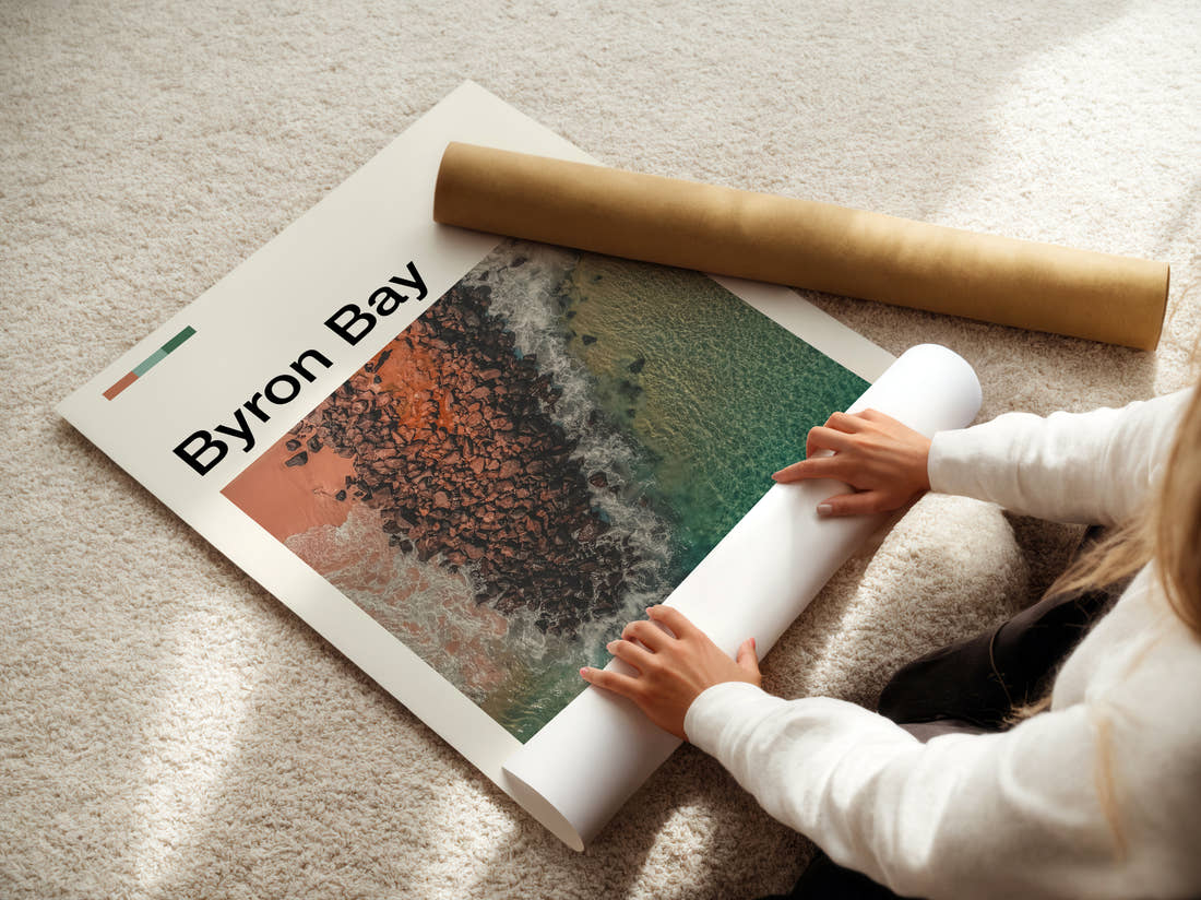 Byron Bay Rocky Reef From Above Travel Print being unrolled from its postal tube
