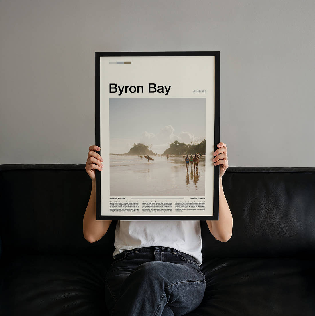 Byron Bay Surfers On The Beach Travel Print held up by hand to show the size of the print