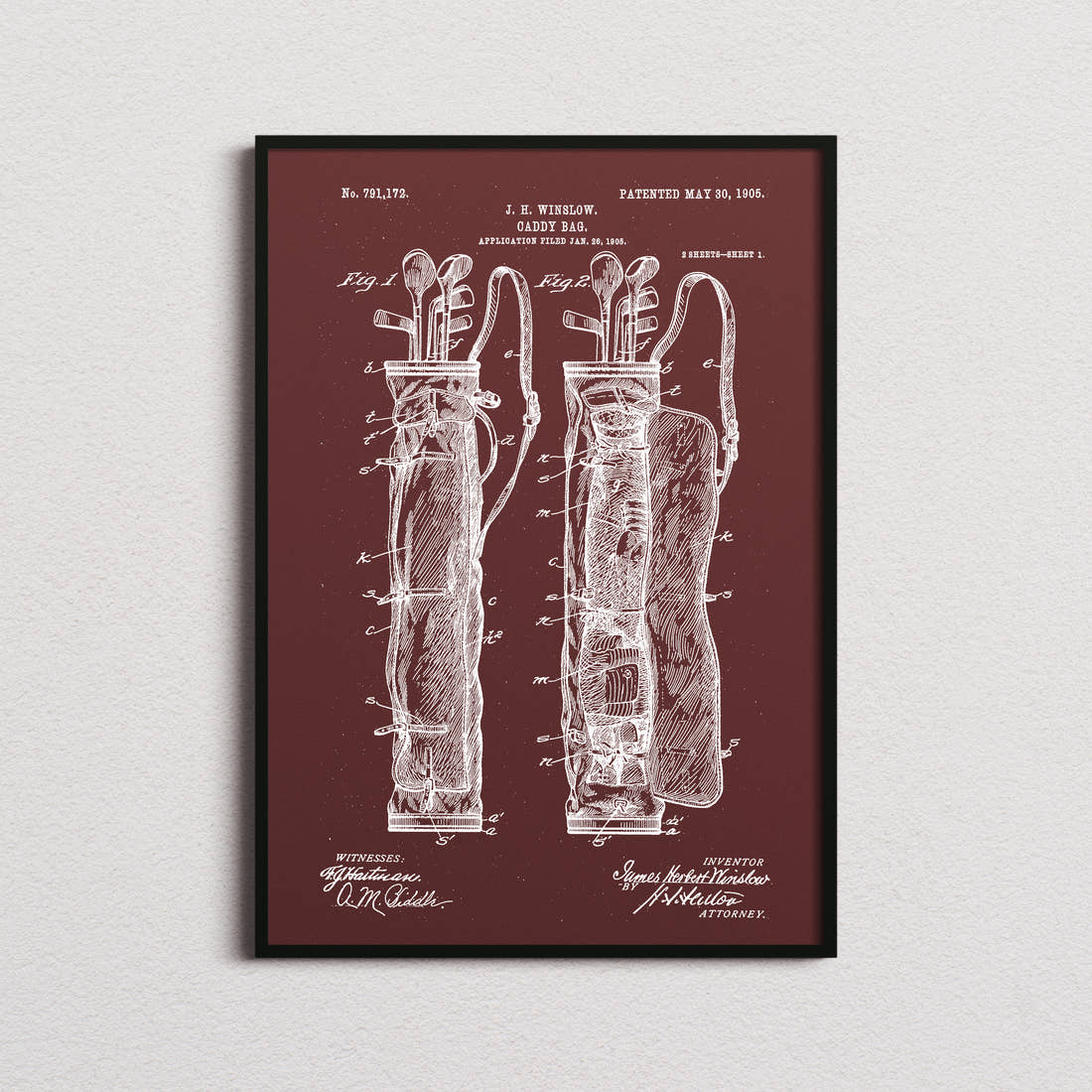 Caddy Bag Patent Print in the burgundy colourway, framed