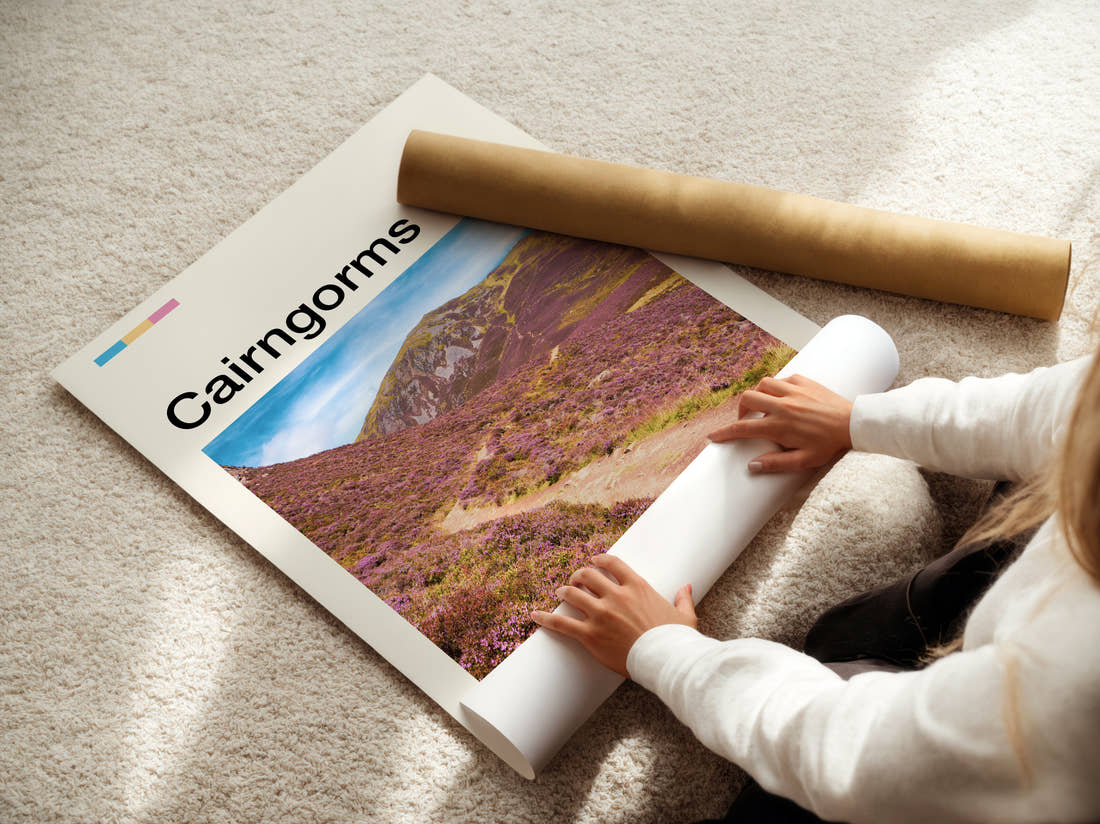 Cairngorms Purple Heather Hillside Travel Print being unrolled from its postal tube