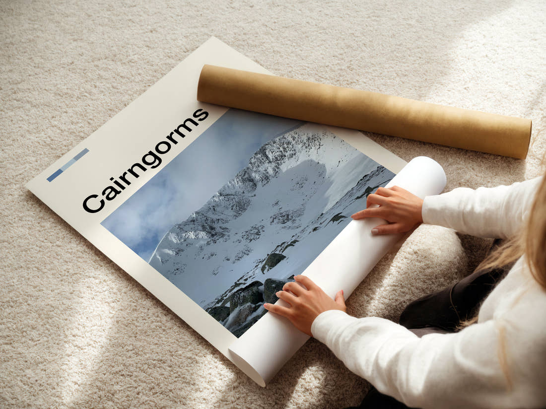 Cairngorms Snowy Mountains Travel Print being unrolled from its postal tube